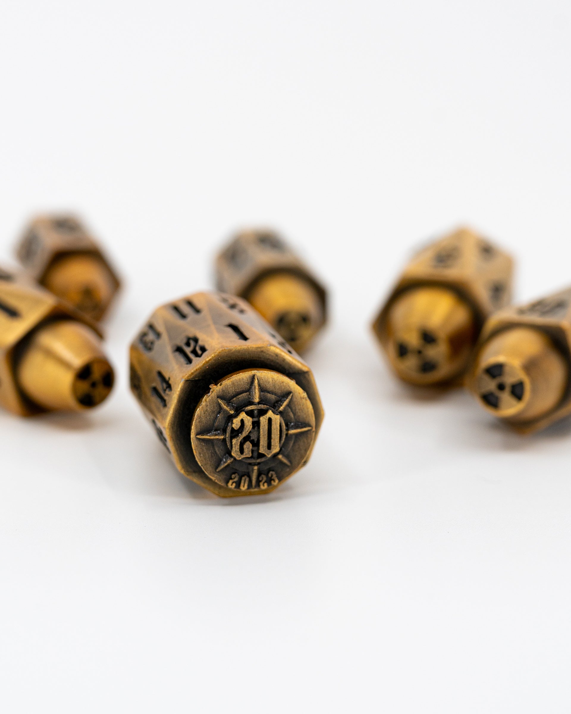 Alpha | Brass Bullets | 7 Piece Metal Dice Set - Emberglow Gaming